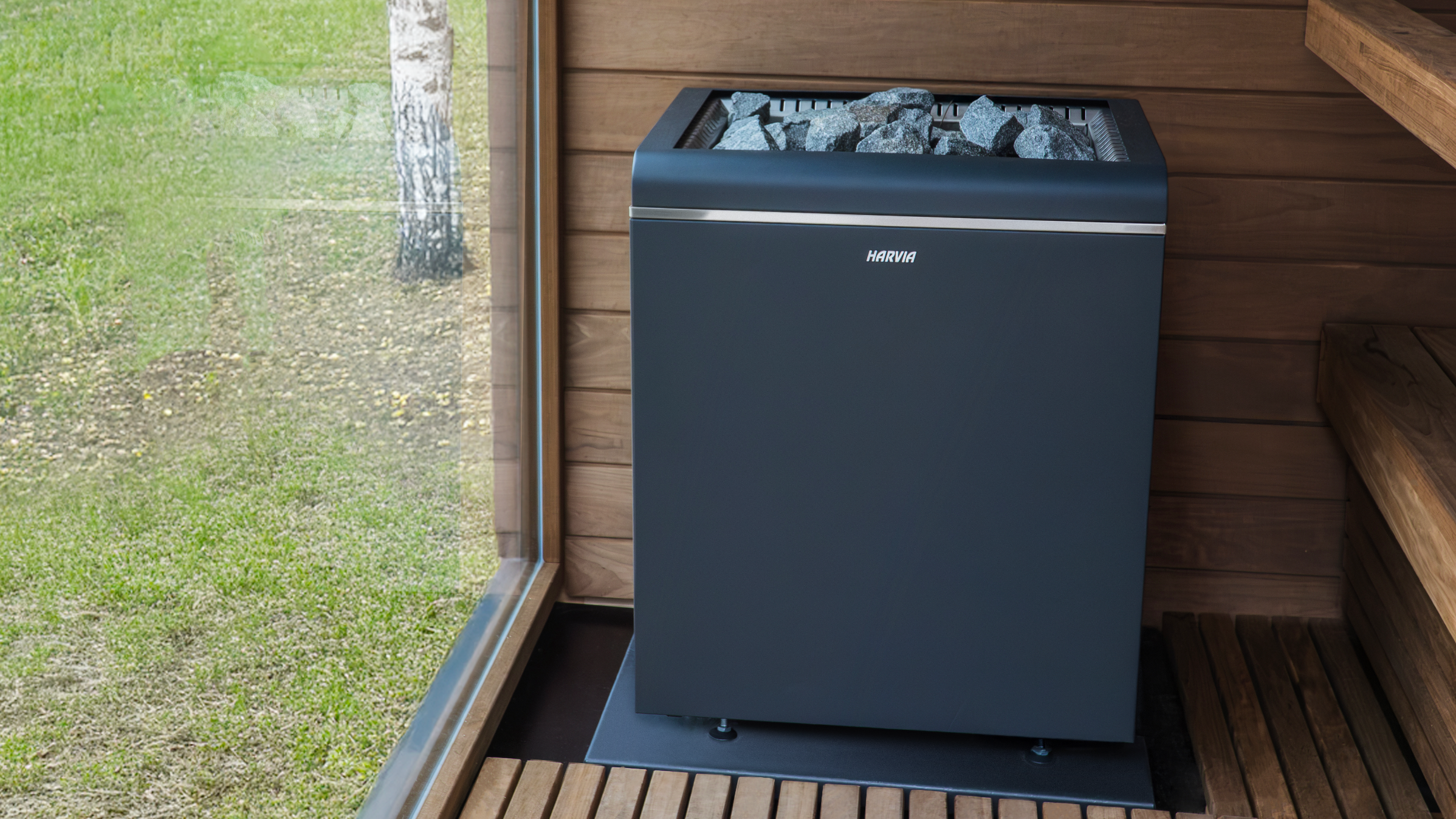 A black square sauna heater in a sauna.