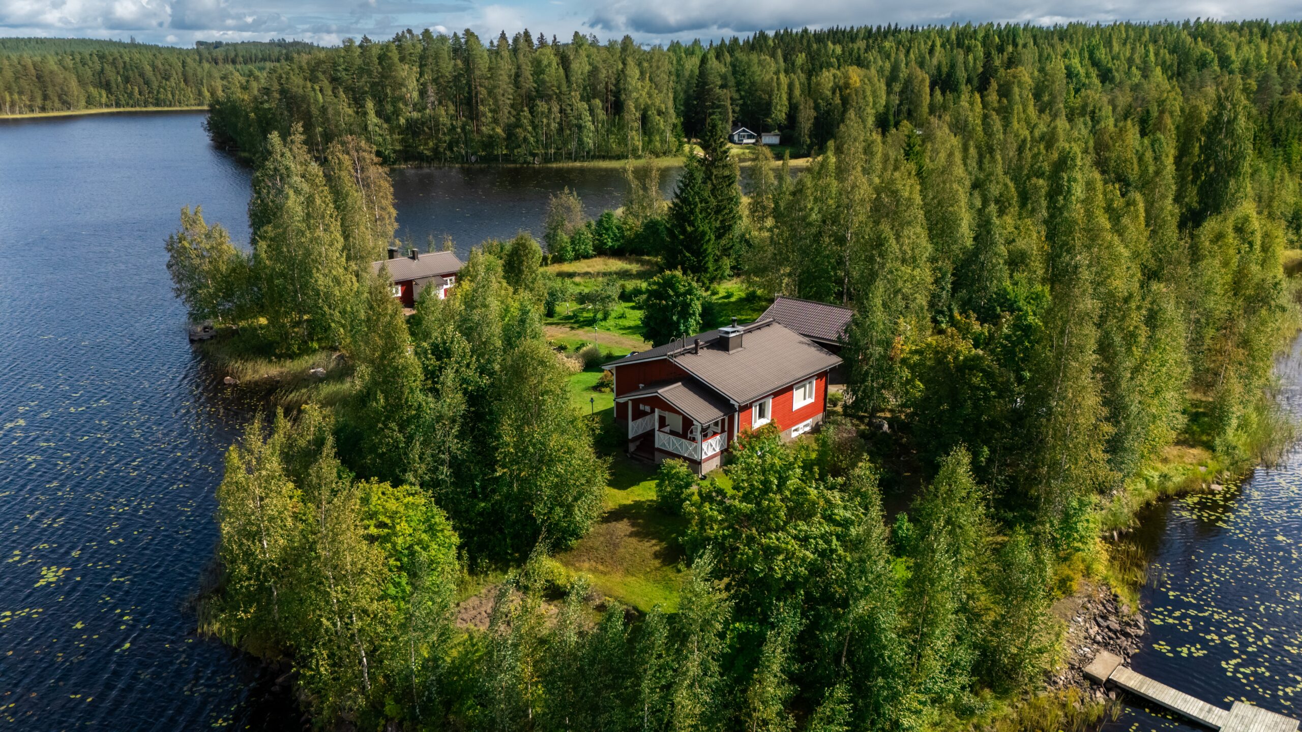 Aerial view of Cefmof’s Hydrogen House surrounded by forest and lakes in Central Finland.