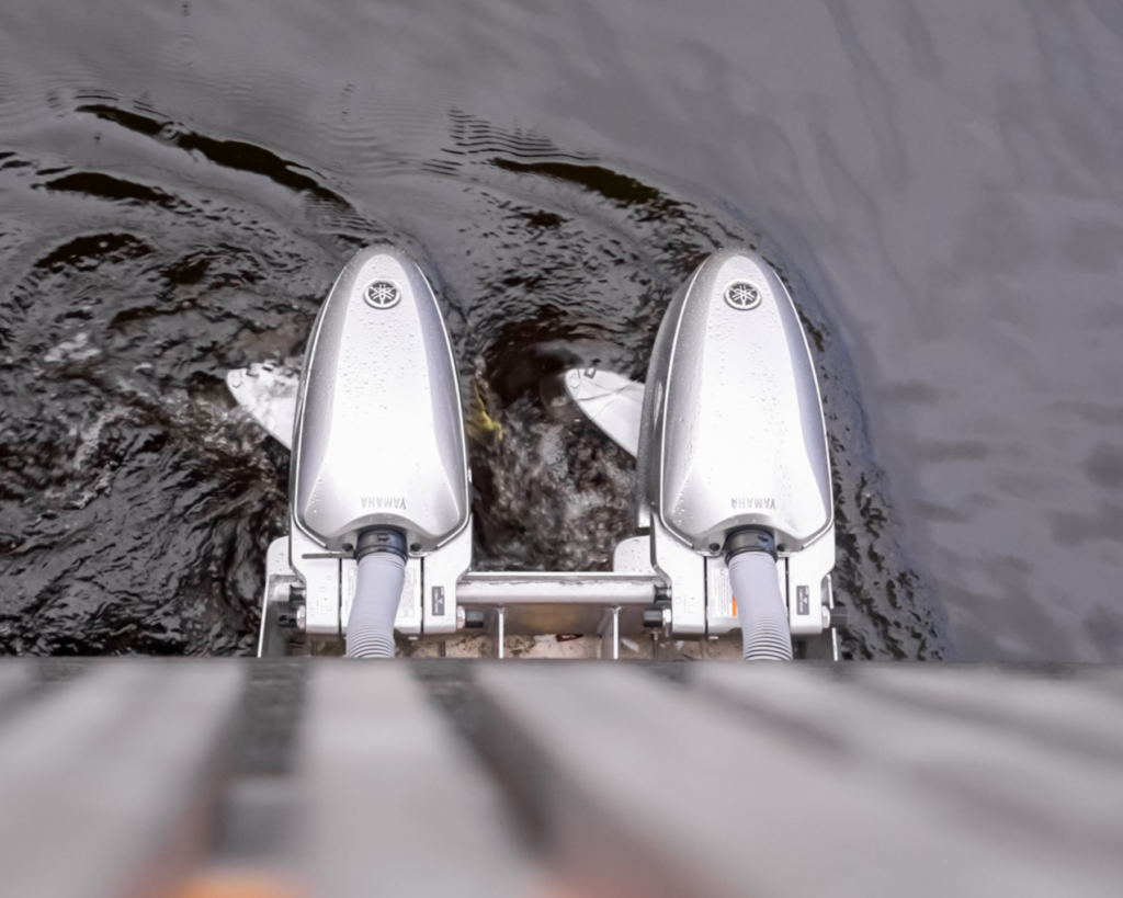 Close-up of two Harmo electric propulsion units operating in the water.