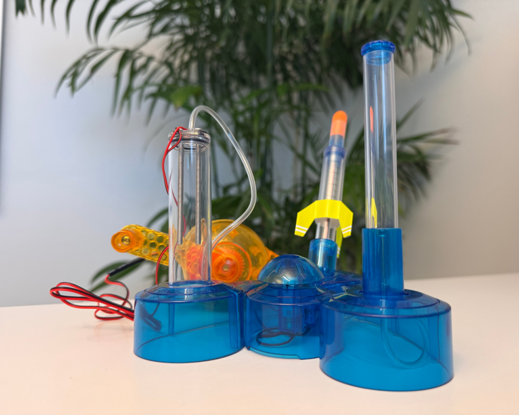 A hydrogen rocket kit with a launcher and rocket components used in a hands-on workshop during the Hydrogen Pitstop event.