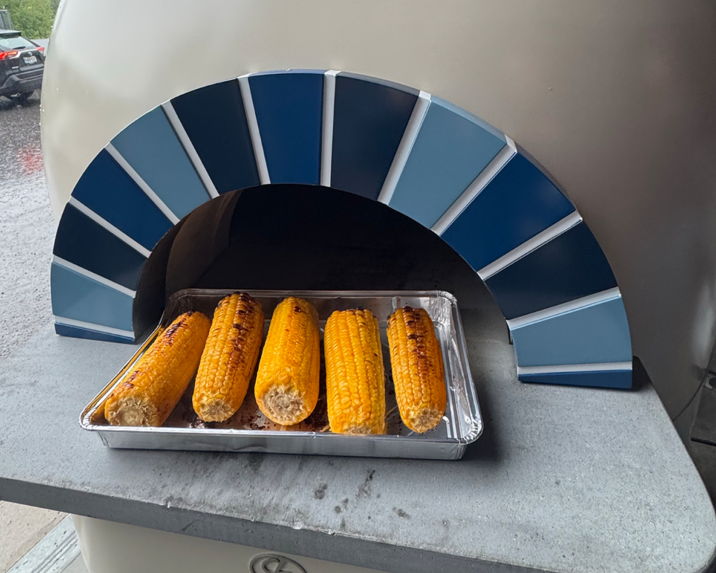 Corn on the cob cooking in a hydrogen-powered oven during the Hydrogen Pitstop event.